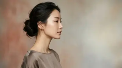 A beautiful woman presenting a contoured jawline alongside medical cosmetic tools