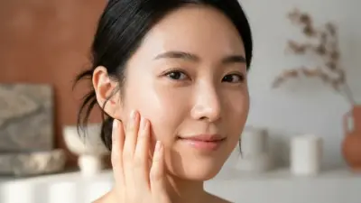 A close-up of a woman's face showing perfectly hydrated and dewy skin.