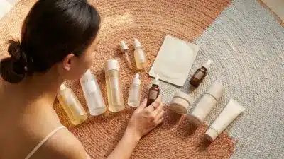 A complete set of Korean skincare products arranged in order on a terracotta background.
