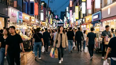 A bustling street in Myeongdong filled with neon signs for Korean beauty shops and crowds of shoppers at twilight.