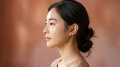 Close up of a balanced and beautifully contoured female facial profile highlighting the nasal bridge.