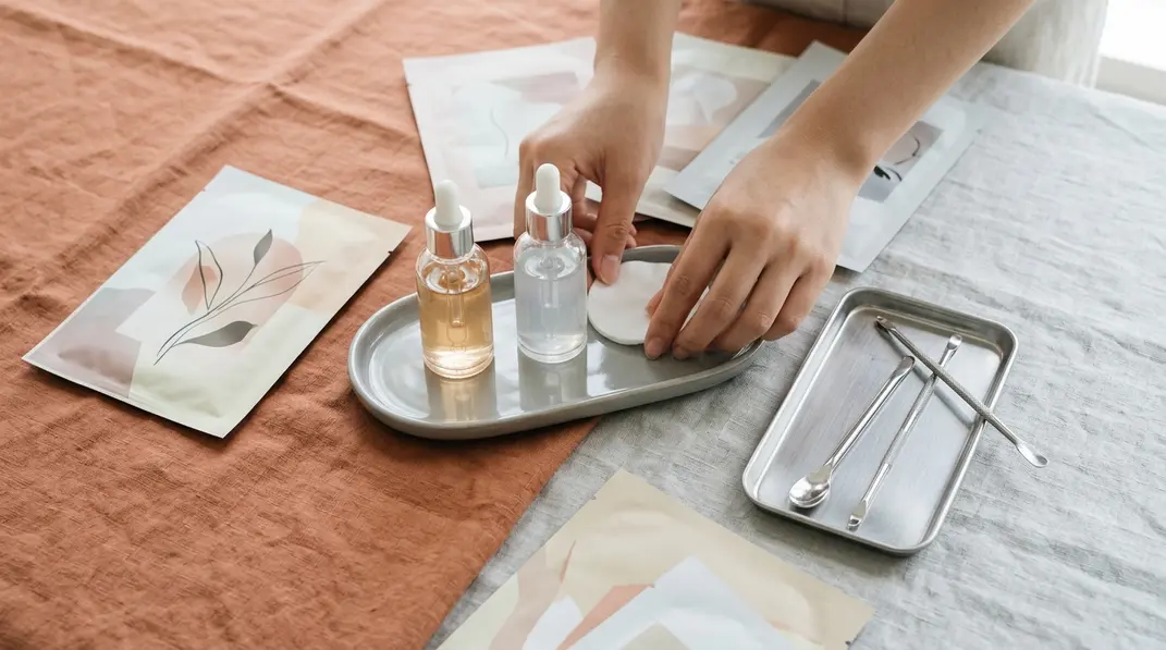 A serene setup featuring Korean sheet masks, glowing serums, and clinical skincare tools, representing professional dermatology care.